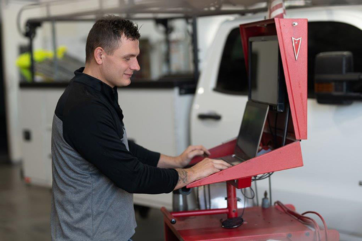 Toby and a technician creating a blueprint