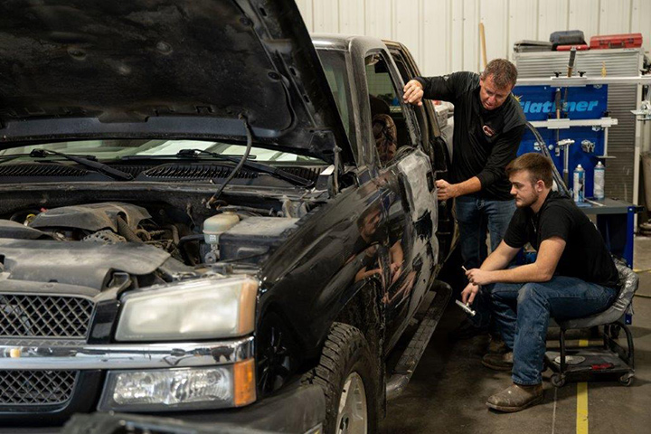 Mark checking out repairs made to a vehicle